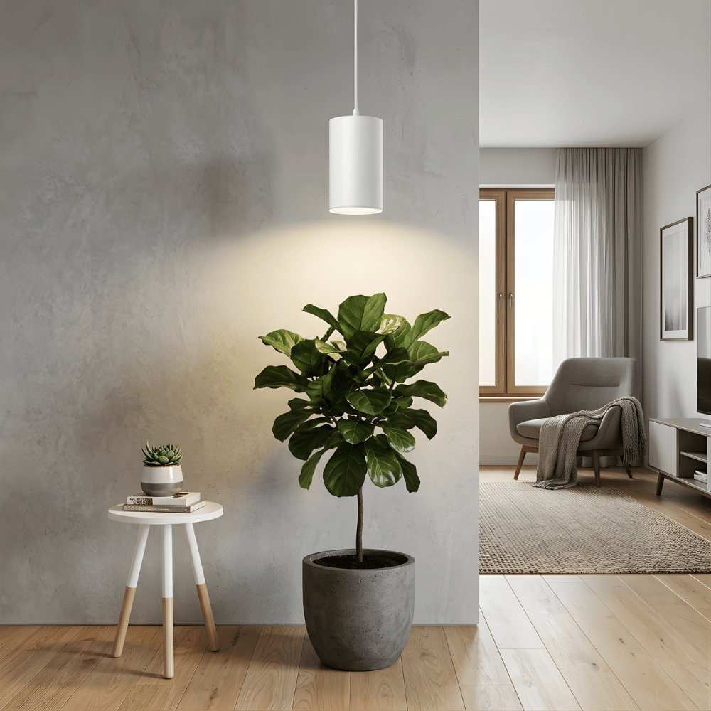Potted plant and white pendant grow light in a modern living room with a neutral color scheme