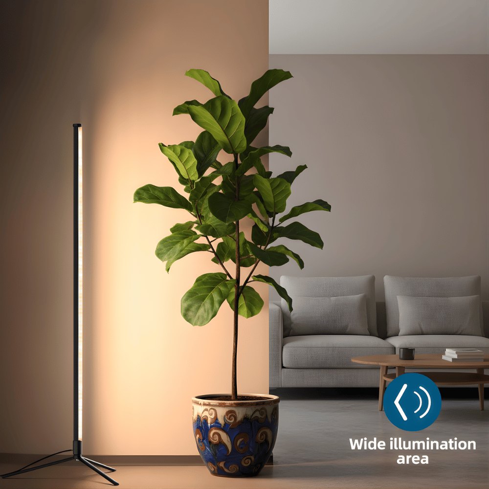Potted plant next to a modern floor grow light in a room with a chair and table.