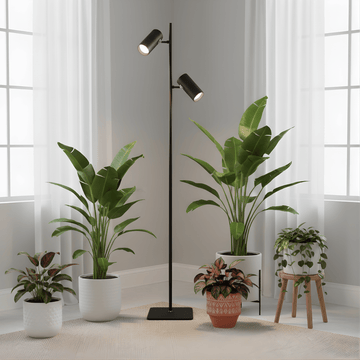 Modern floor grow light with multiple potted plants in a room with large windows.